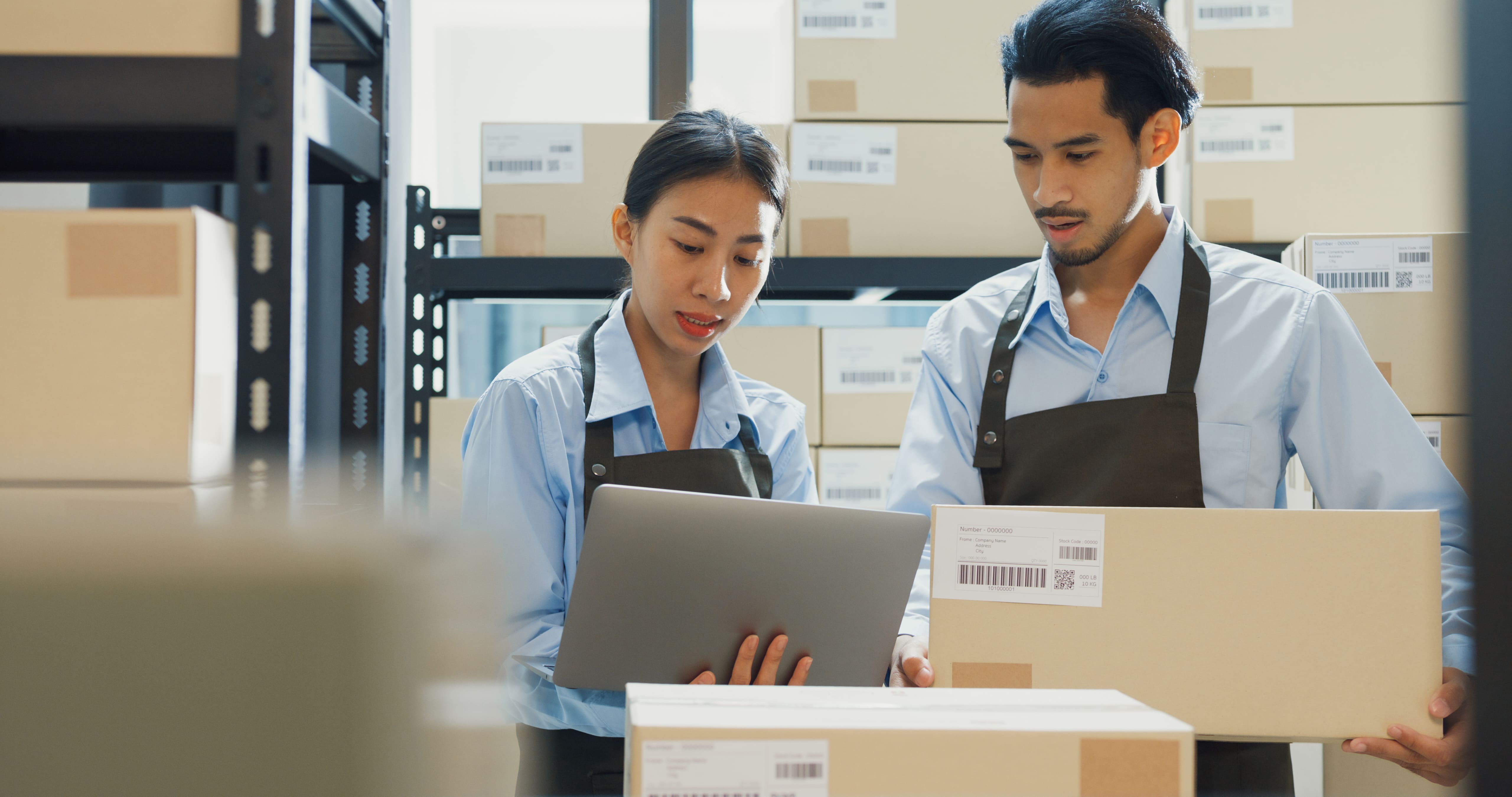 Uoho sourcing team reviewing shipment details in a warehouse